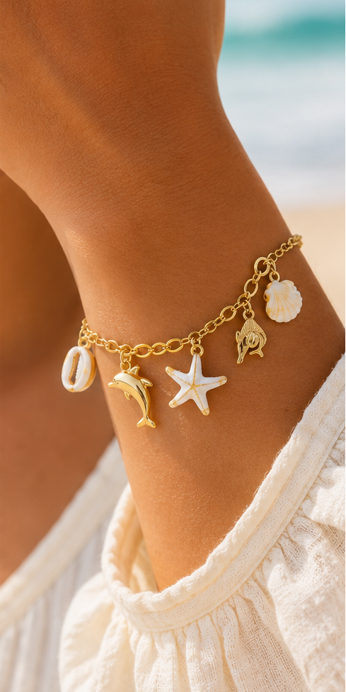 Bracelet Charms Océan en Acier Inoxydable Doré – Coquillage, Étoile de Mer & Dauphin